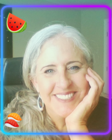 selfie from flipgrid with silly filter of Mrs. Dorsey, a smiling woman with gray hair in a ponytail